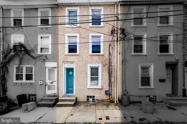 a front view of a house with a glass windows