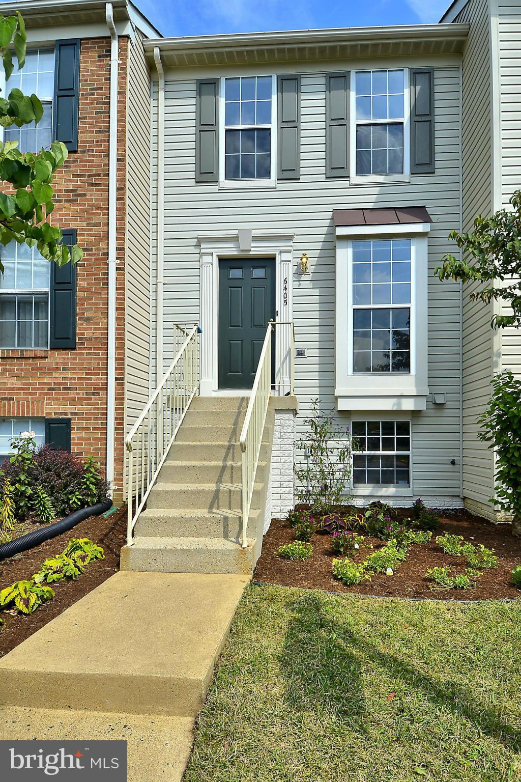 6405 Racetec Court Springfield, VA 22150 - Photo 1 of 30 a front view of a house with a yard