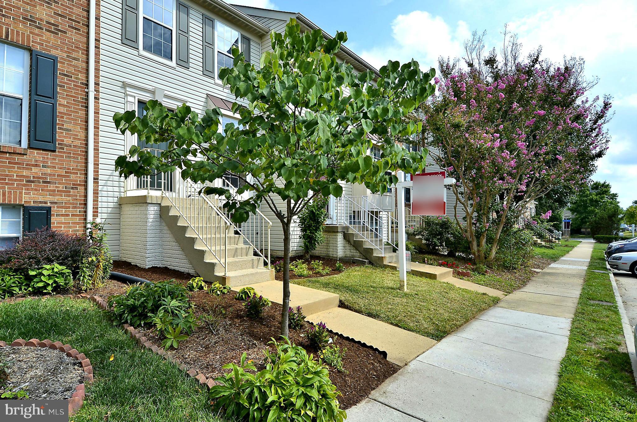 6405 Racetec Court Springfield, VA 22150 - Photo 2 of 30 a front view of a house with a yard