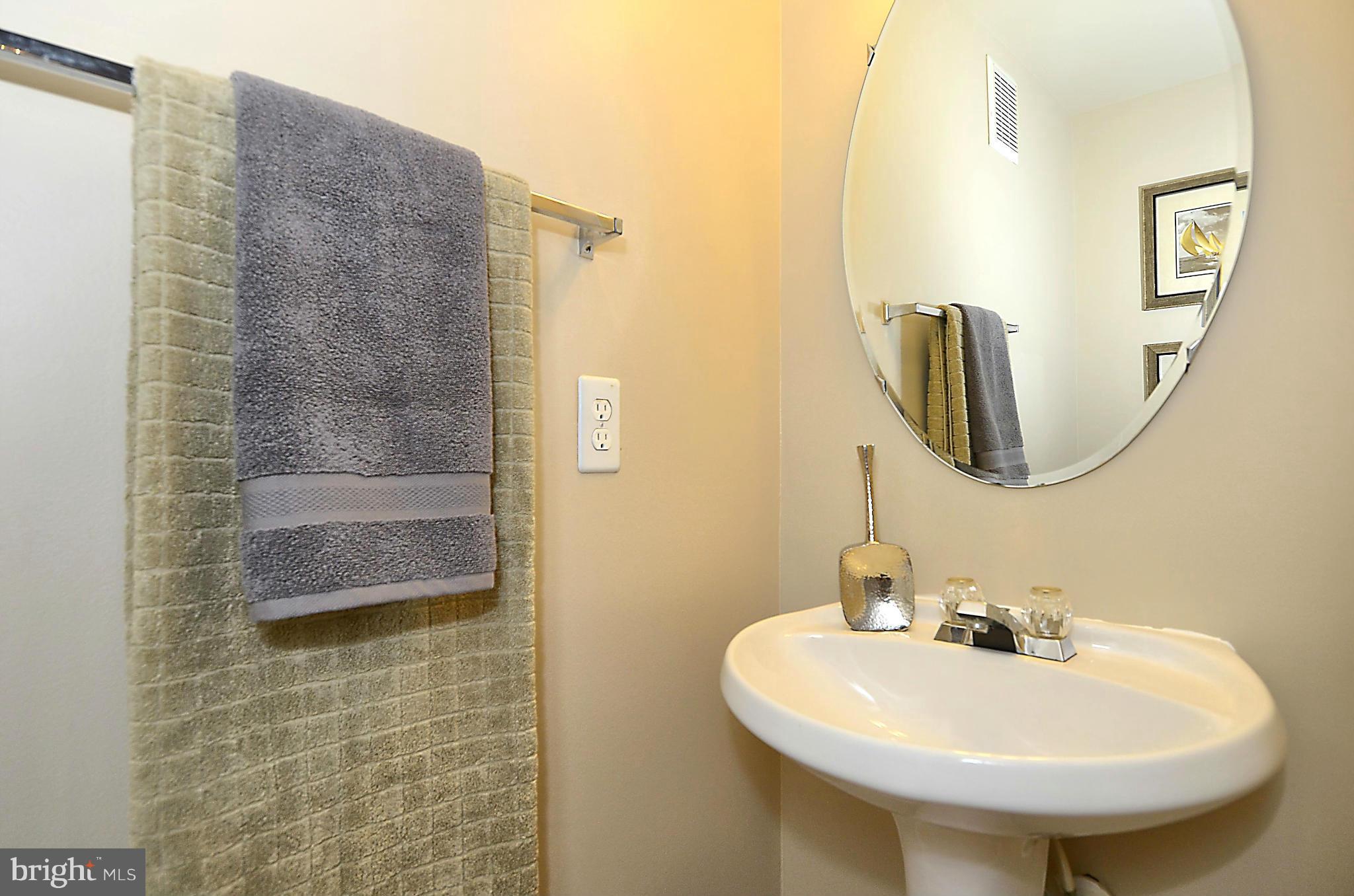 6405 Racetec Court Springfield, VA 22150 - Photo 11 of 30 a bathroom with a sink a mirror a vanity and shower