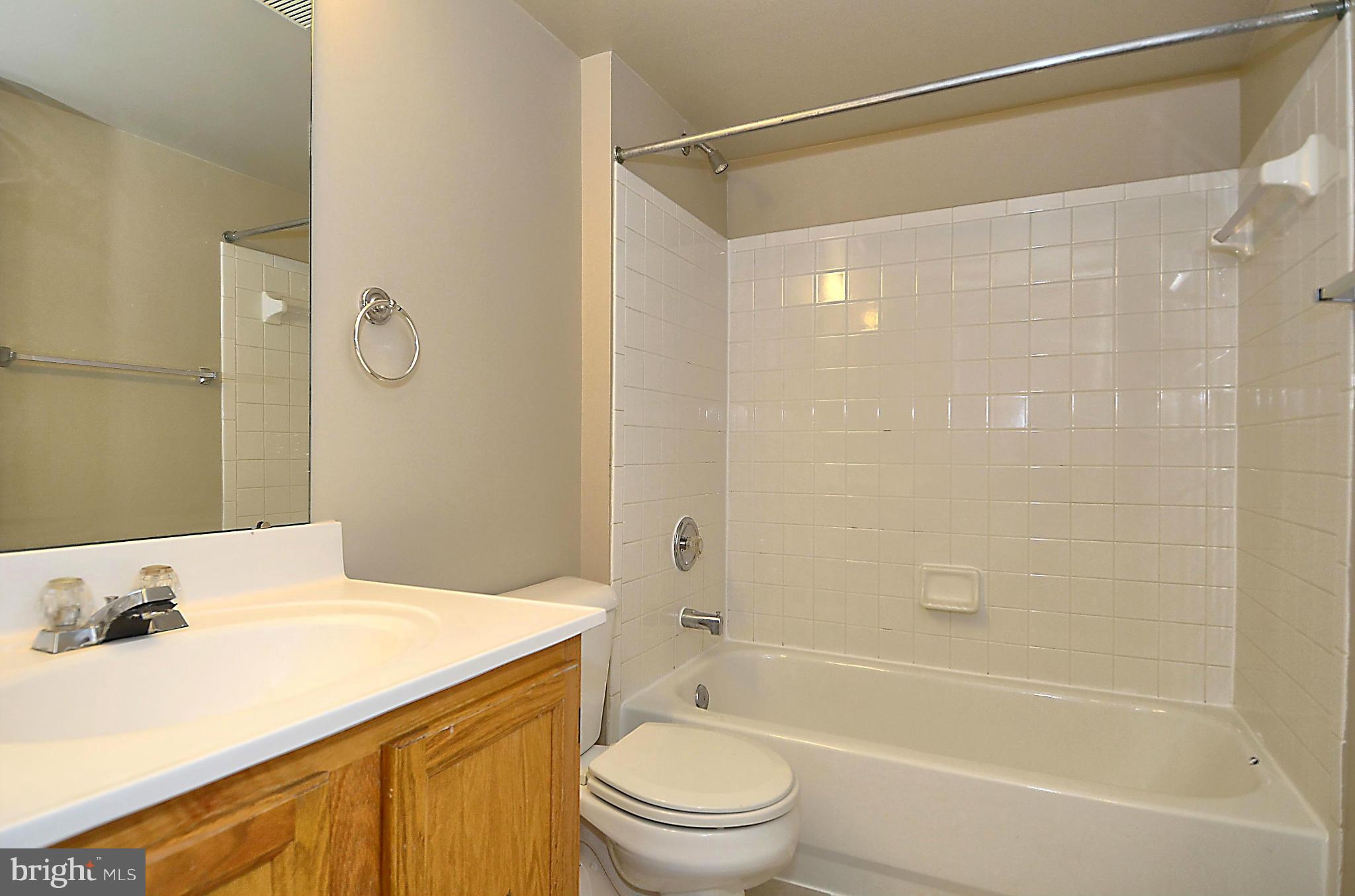 6405 Racetec Court Springfield, VA 22150 - Photo 21 of 30 a bathroom with a sink and a mirror