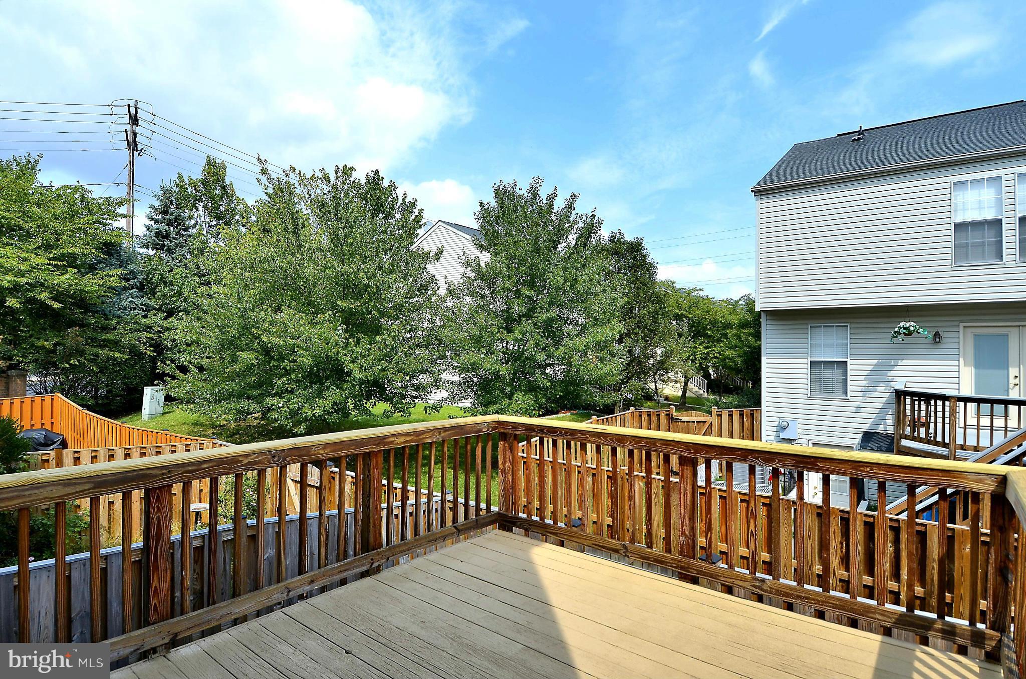 6405 Racetec Court Springfield, VA 22150 - Photo 22 of 30 a view of a wooden roof deck