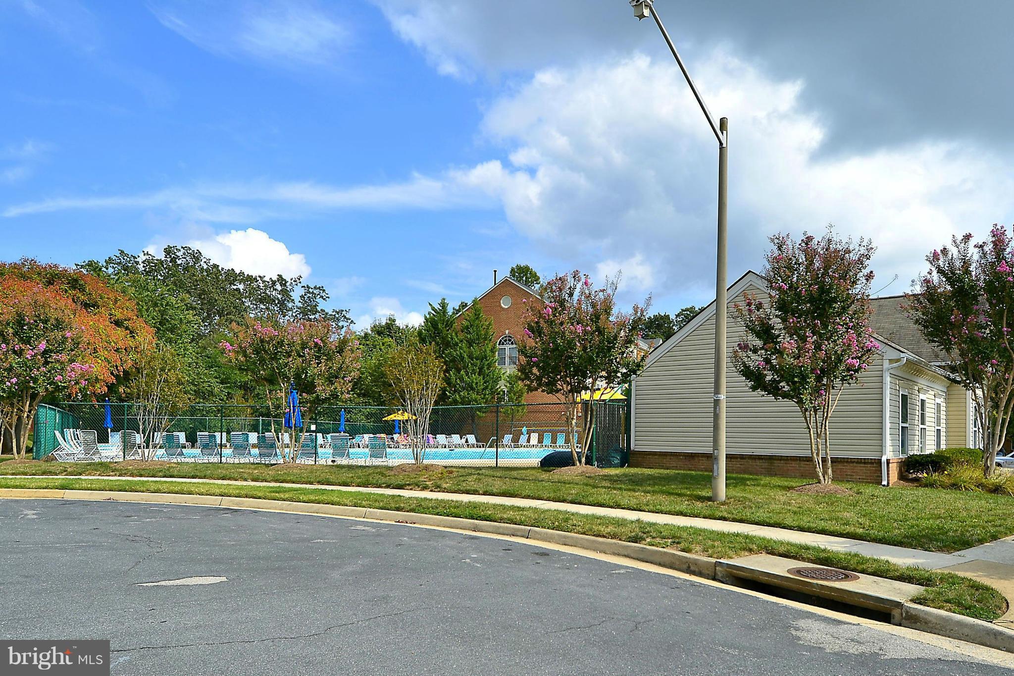 6405 Racetec Court Springfield, VA 22150 - Photo 27 of 30 a view of swimming pool is middle in the garden