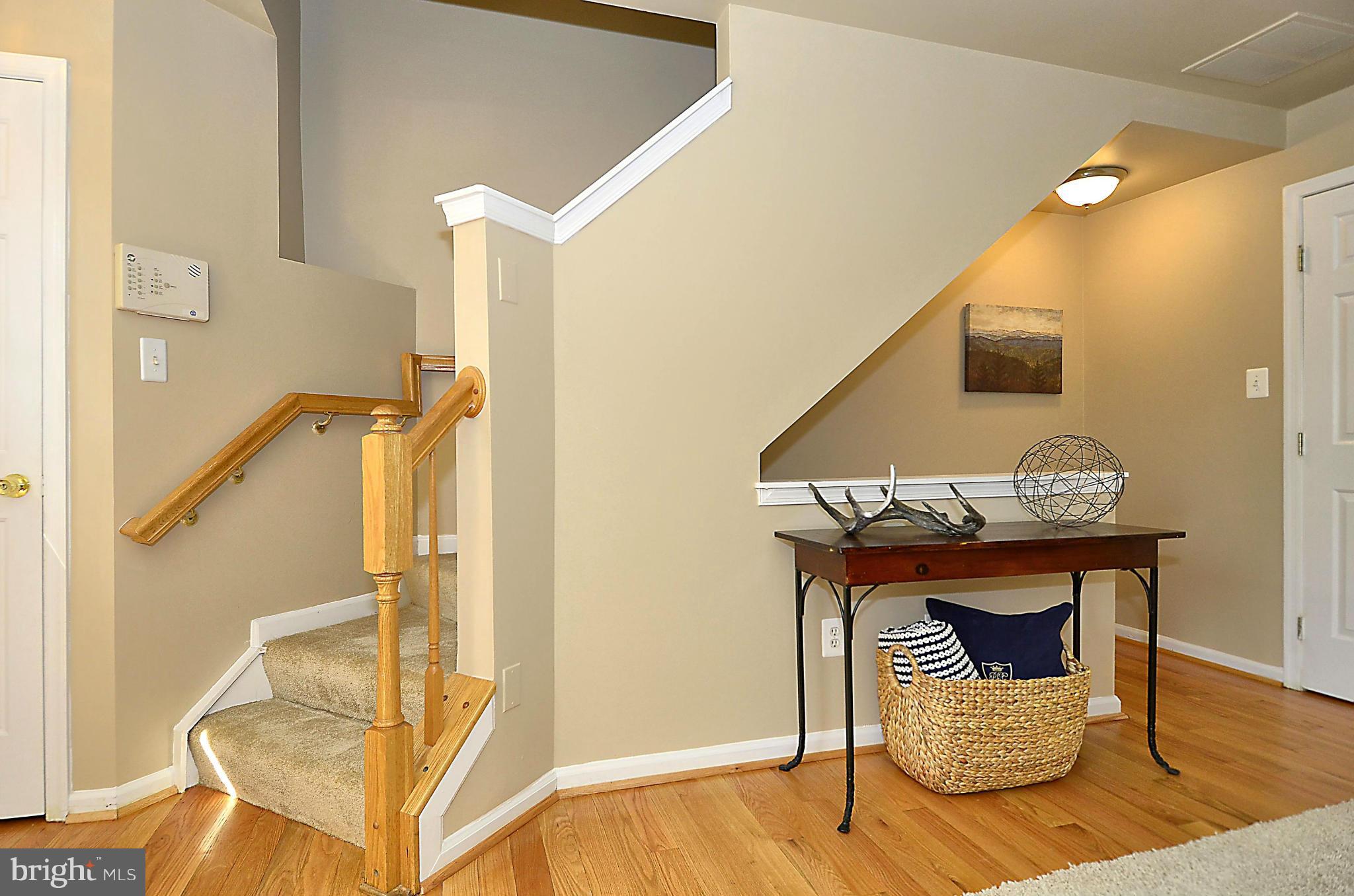 6405 Racetec Court Springfield, VA 22150 - Photo 3 of 30 a view of front door with chair and wooden floor