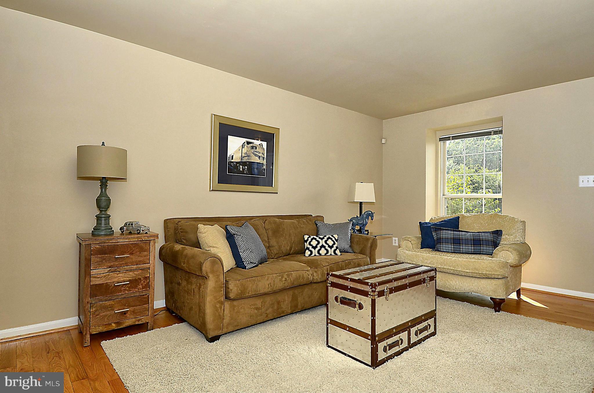 6405 Racetec Court Springfield, VA 22150 - Photo 6 of 30 a living room with furniture and a window