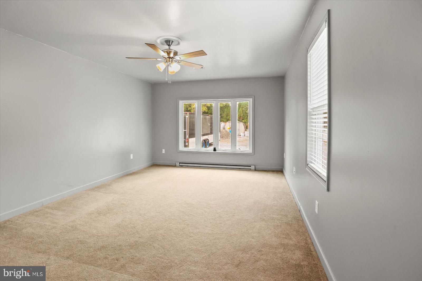 21 Skyport Road Mechanicsburg, PA 17050 - Photo 14 of 35 an empty room with windows and fan