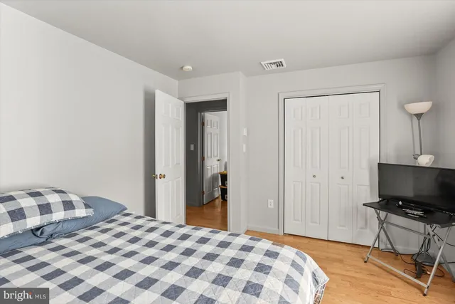 a bedroom with a bed and a tv