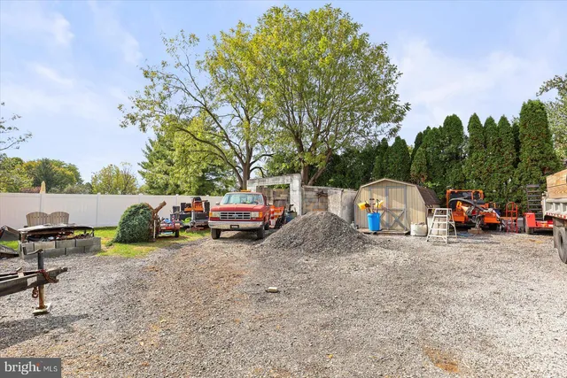 a view of a backyard with a car parked