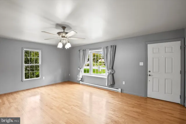 a view of an empty room with a window