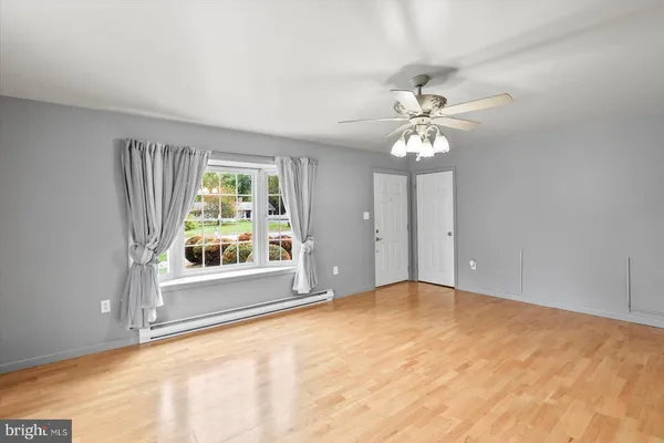 a view of an empty room with a window