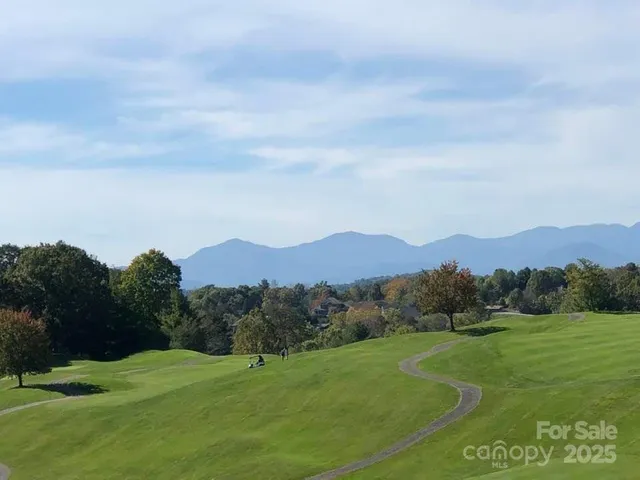 a view of an ocean with a mountain in the background