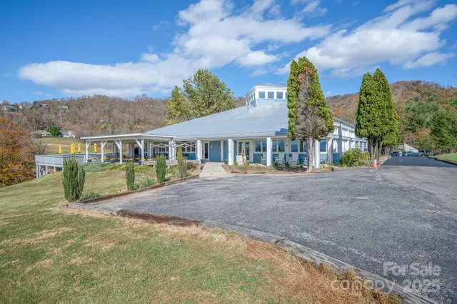 a view of house with outdoor space and street view