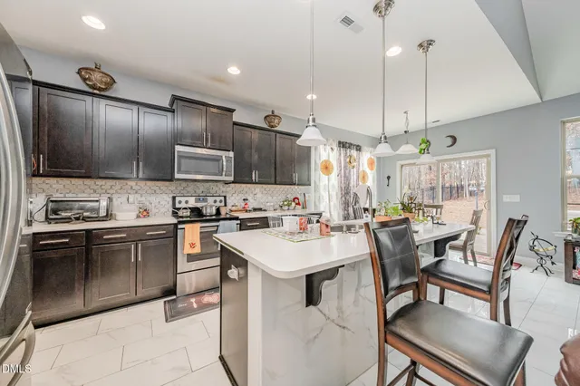 a view of a dining room with furniture window and outside view