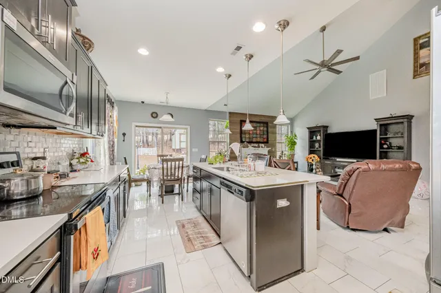 a view of a dining room with furniture and window