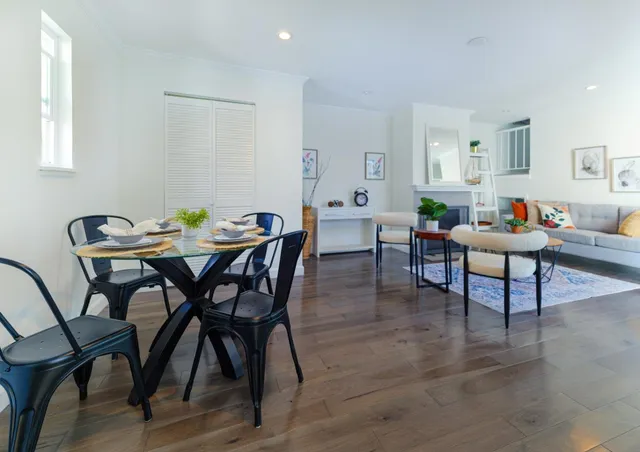 a view of living room with furniture and floor to ceiling window