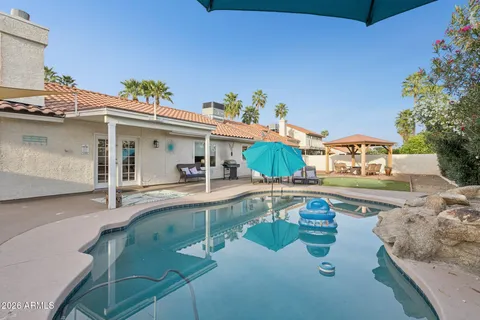 a view of a patio in backyard