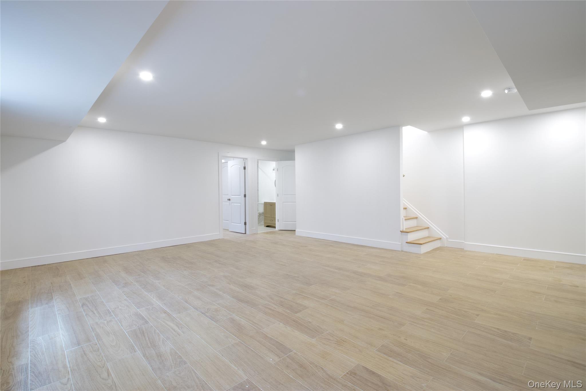 30 Kirkwood Road, Unit B Port Washington, NY 11050 - Photo 29 of 36 a view of an empty room with a kitchen