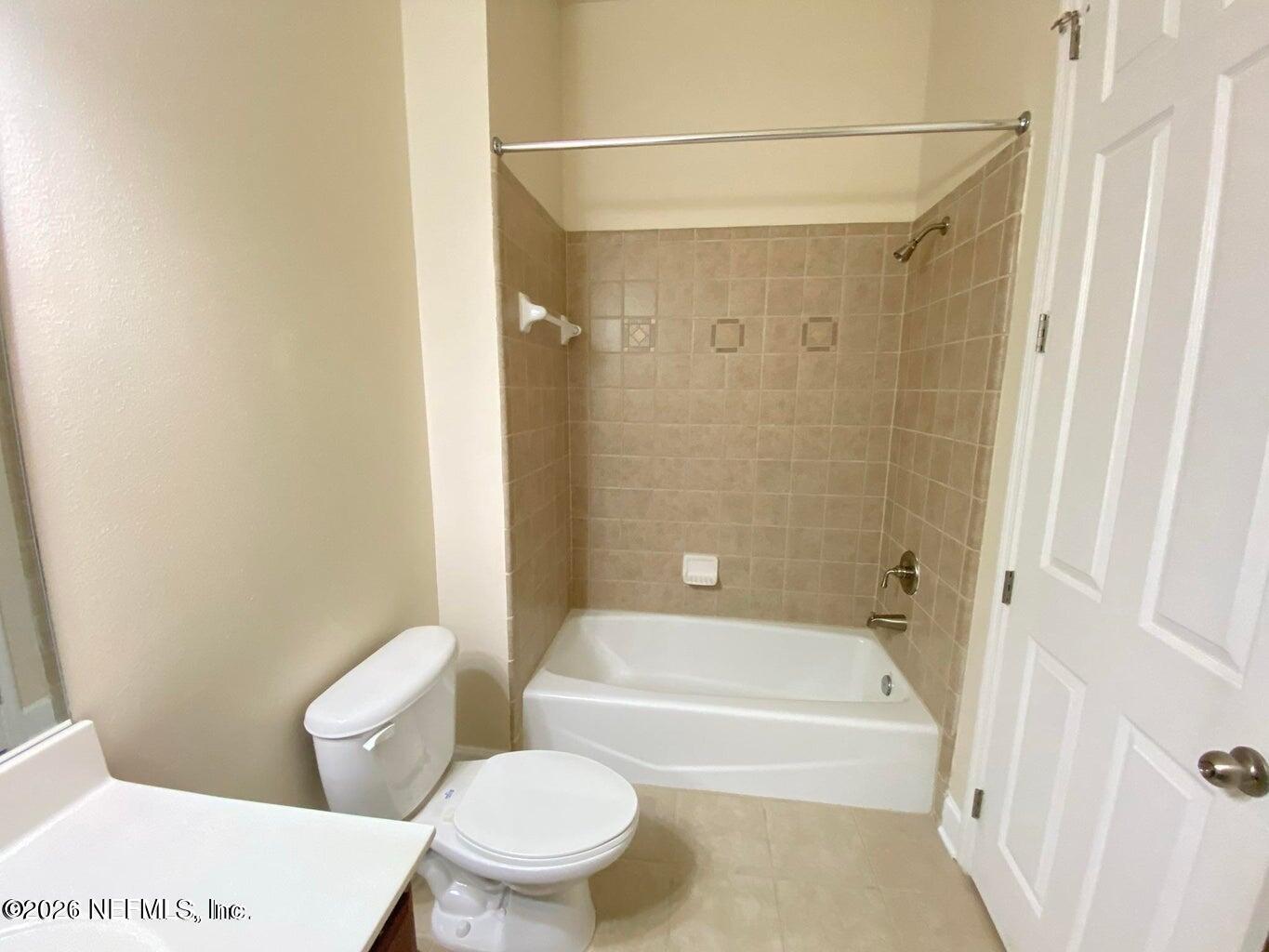 2035 Secret Garden Lane, Unit 504 Fleming Island, FL 32003 - Photo 15 of 32 a bathroom with a toilet and a bathtub