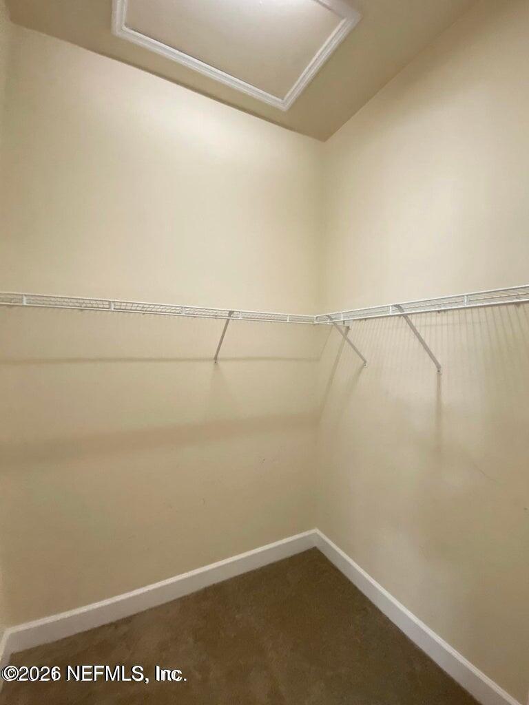 2035 Secret Garden Lane, Unit 504 Fleming Island, FL 32003 - Photo 17 of 32 a view of a room with racks on the wall