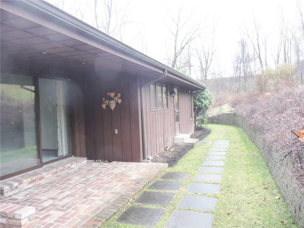 324-328 Guys Run Road Cheswick, PA 15024 - Photo 2 of 25 This custom built home blends beautifully with the large private lot.