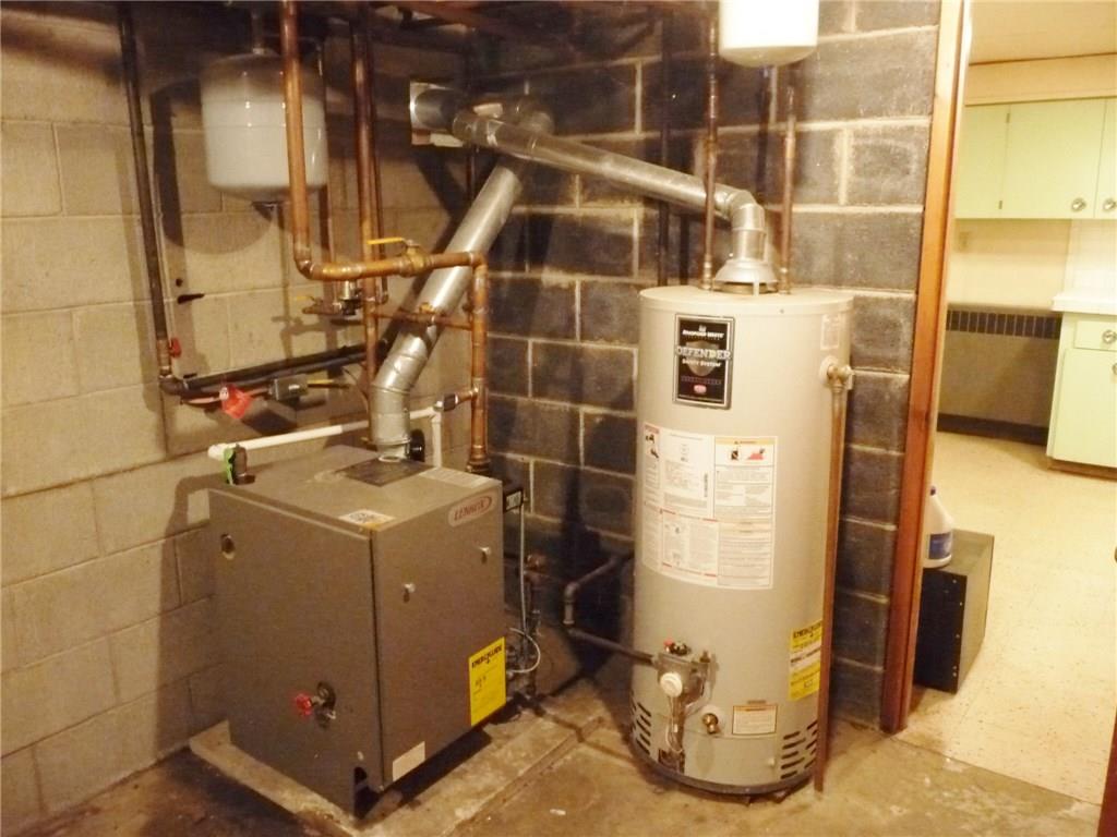 324-328 Guys Run Road Cheswick, PA 15024 - Photo 19 of 25 Utility room with gas fired boiler with five zone valves and gas fired hot water tank. First floor of the home is air conditioned with a newer attic mounted system.