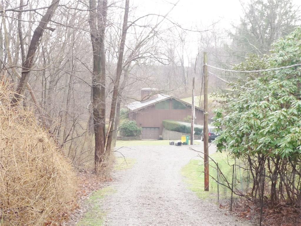 324-328 Guys Run Road Cheswick, PA 15024 - Photo 23 of 25 View from about the mid point of the driveway. There is a large turn around and parking area. Mature trees and shrubs offer a private setting.