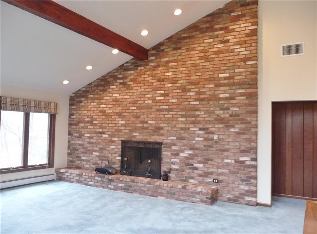 324-328 Guys Run Road Cheswick, PA 15024 - Photo 4 of 25 The heart of this home is the dramatic open great room with log burning fireplace.