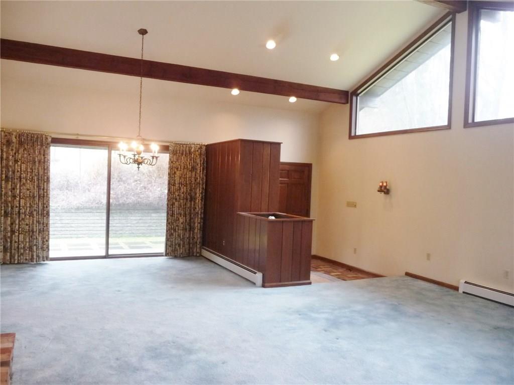 324-328 Guys Run Road Cheswick, PA 15024 - Photo 5 of 25 This 29 x 20 room features a sunken entry, trapezoid windows and solid wood ceiling beams. The custom wood closet and storage area are topped with built-in planters with watering drains.