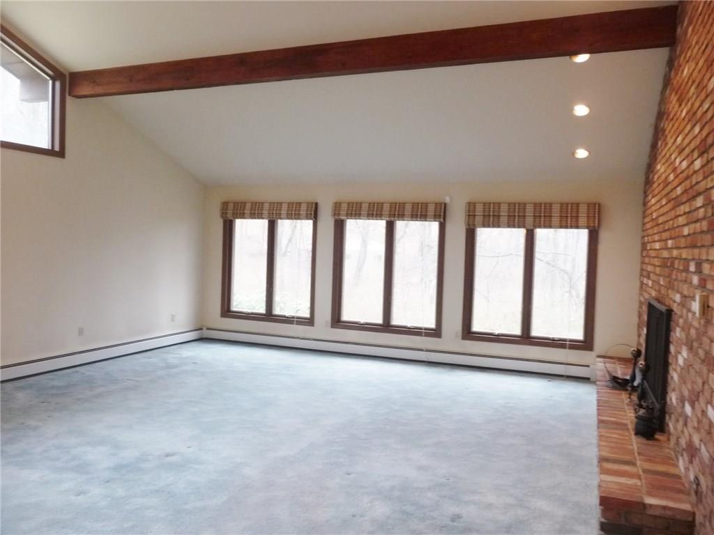 324-328 Guys Run Road Cheswick, PA 15024 - Photo 7 of 25 Three large twin casements afford a terrific natural view. Recessed lighting highlights the entry and fireplace.