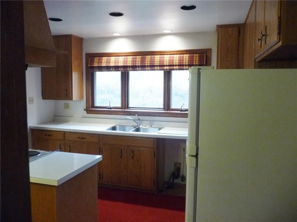 324-328 Guys Run Road Cheswick, PA 15024 - Photo 9 of 25 Sink area with a large casement window and recessed lighting.