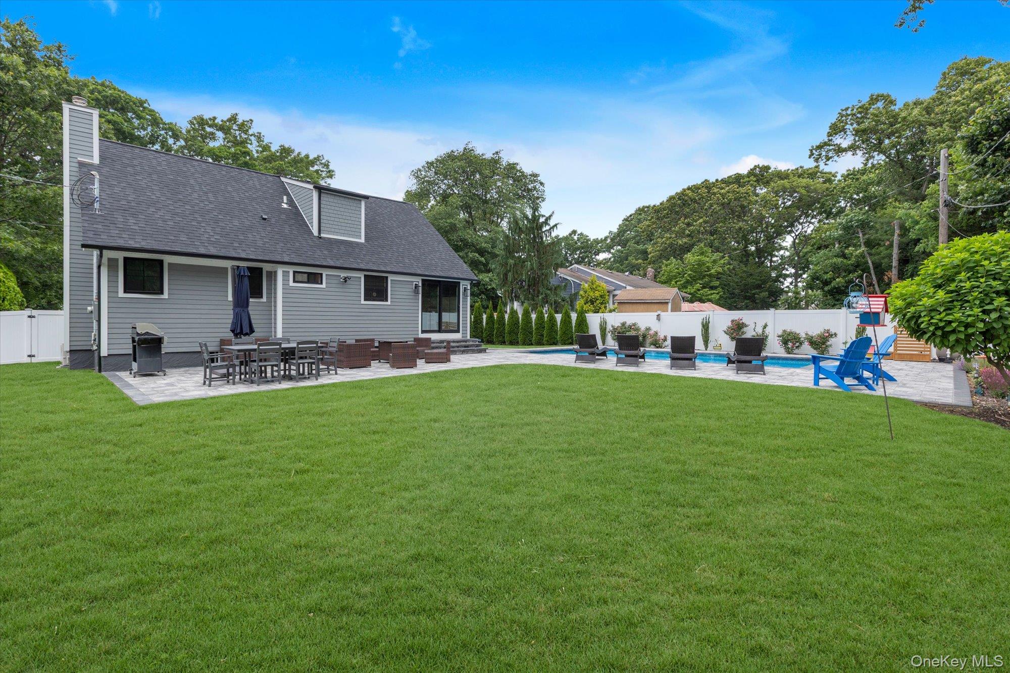 31 Apple Lane Commack, NY 11725 - Photo 21 of 28 Backyard has plenty of grass area beside the patio.