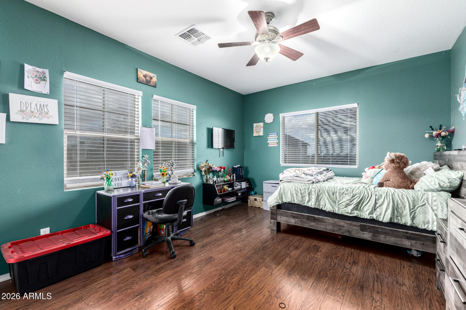 24541 Plum Road Florence, AZ 85132 - Photo 28 of 47 a bedroom with a bed and a chandelier