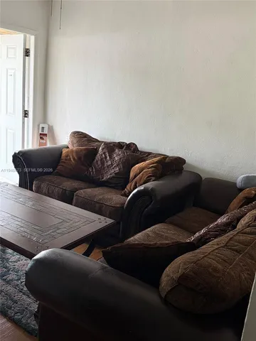 a living room with furniture and a couch