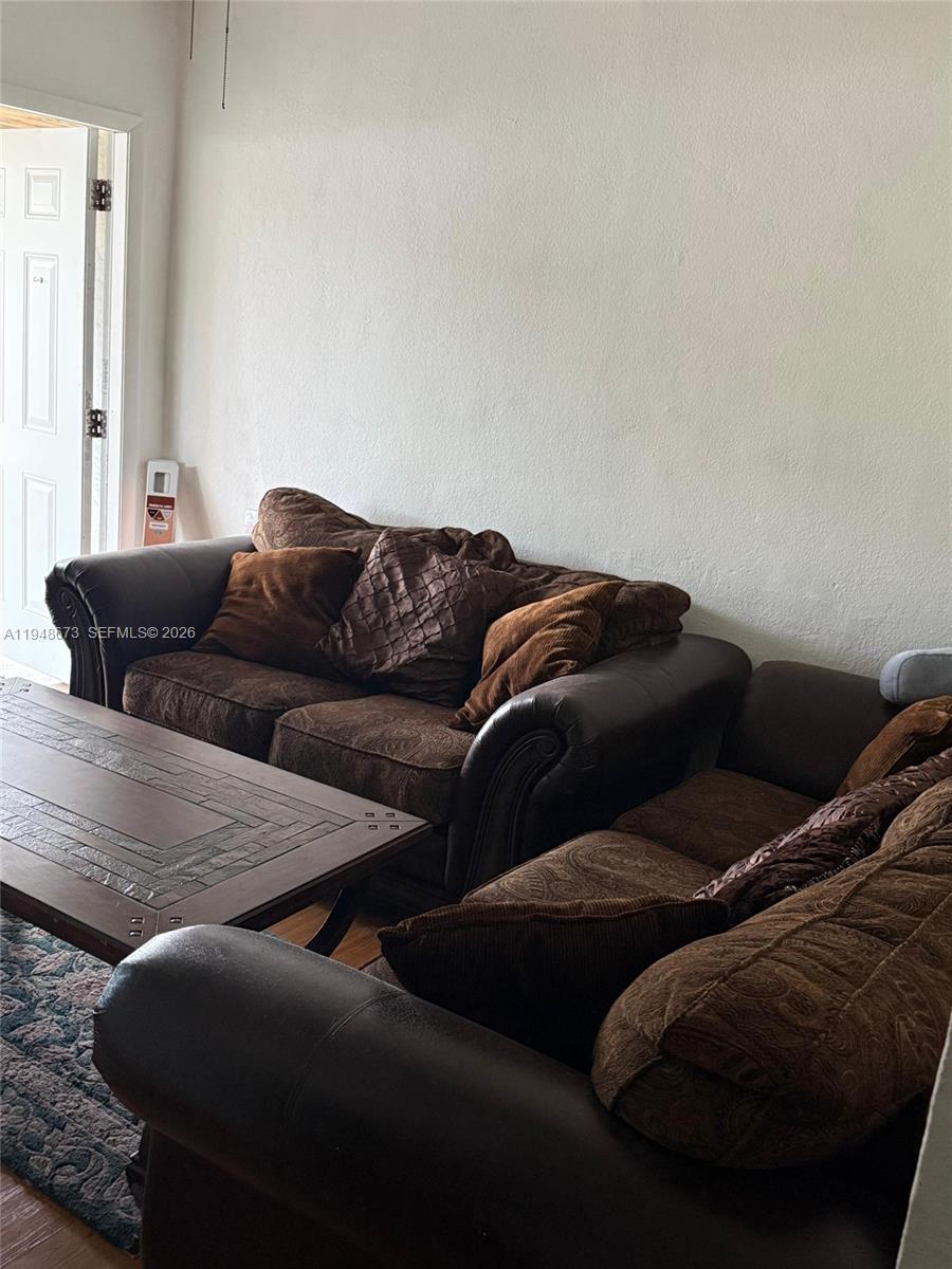 2247 Simms Street, Unit 2 Hollywood, FL 33020 - Photo 3 of 9 a living room with furniture and a couch