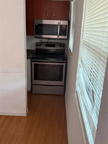 a kitchen with a stove and a microwave