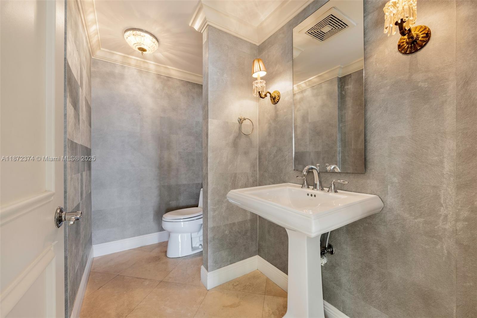 3350 Southwest 27th Avenue, Unit 1402 Miami, FL 33133 - Photo 15 of 23 a bathroom with a sink a toilet and shower