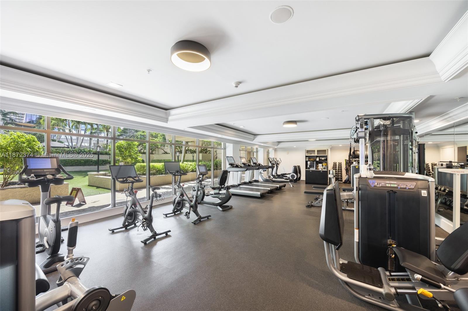 3350 Southwest 27th Avenue, Unit 1402 Miami, FL 33133 - Photo 20 of 23 a gym room with lots of gym equipment