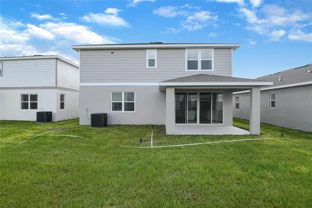 a view of a yard in front of a house