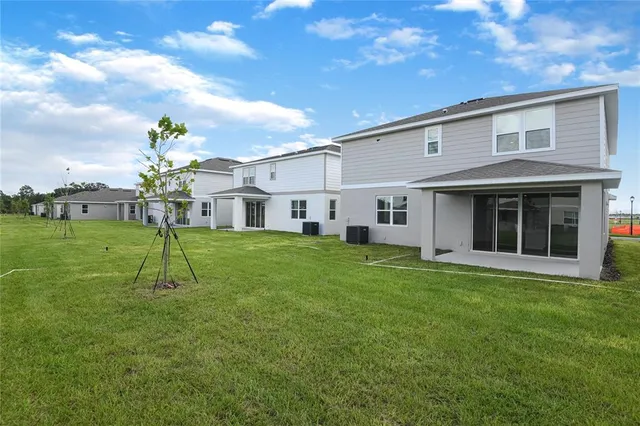 a view of a yard in front of a house