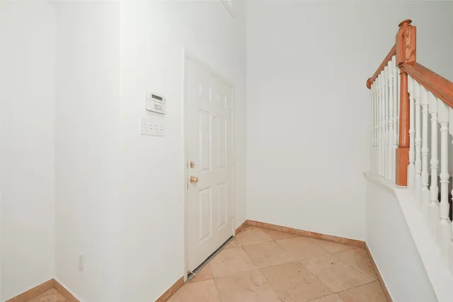 a view of an empty room with stairs