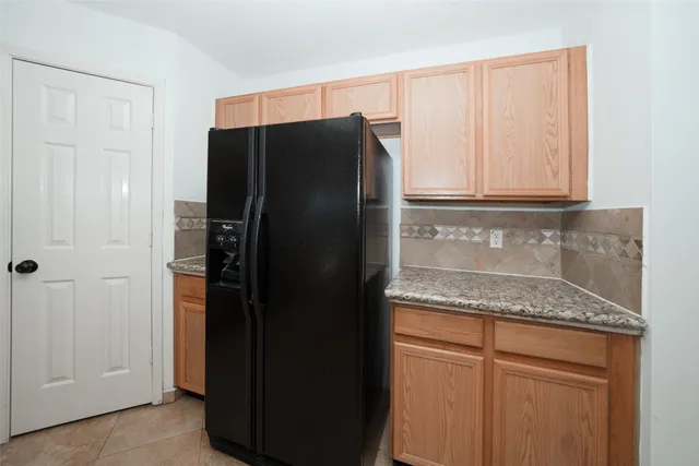 a kitchen with stainless steel appliances granite countertop a sink stove and microwave