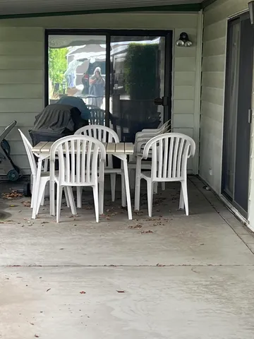 a view of outdoor space with chairs