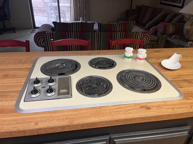 a kitchen with a stove and a microwave
