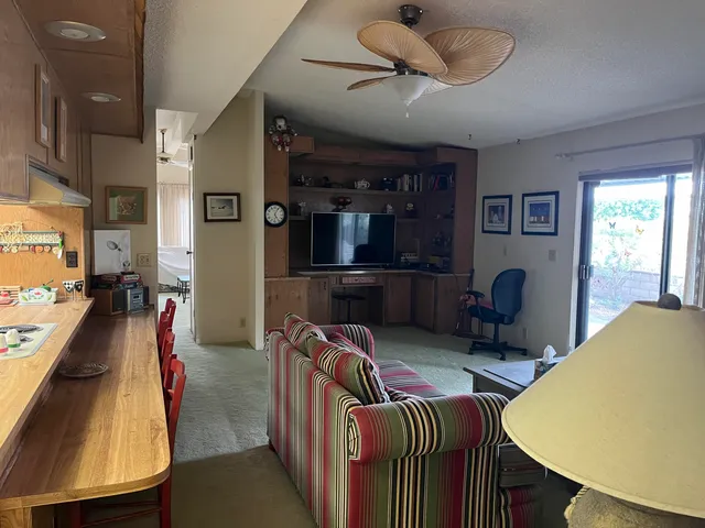 a bedroom with furniture a bed and a window