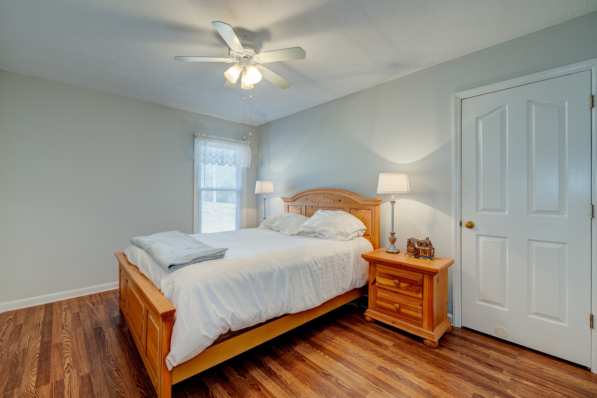 2543 Thompson Road Murfreesboro, TN 37128 - Photo 12 of 46 a bedroom with a bed and a chandelier