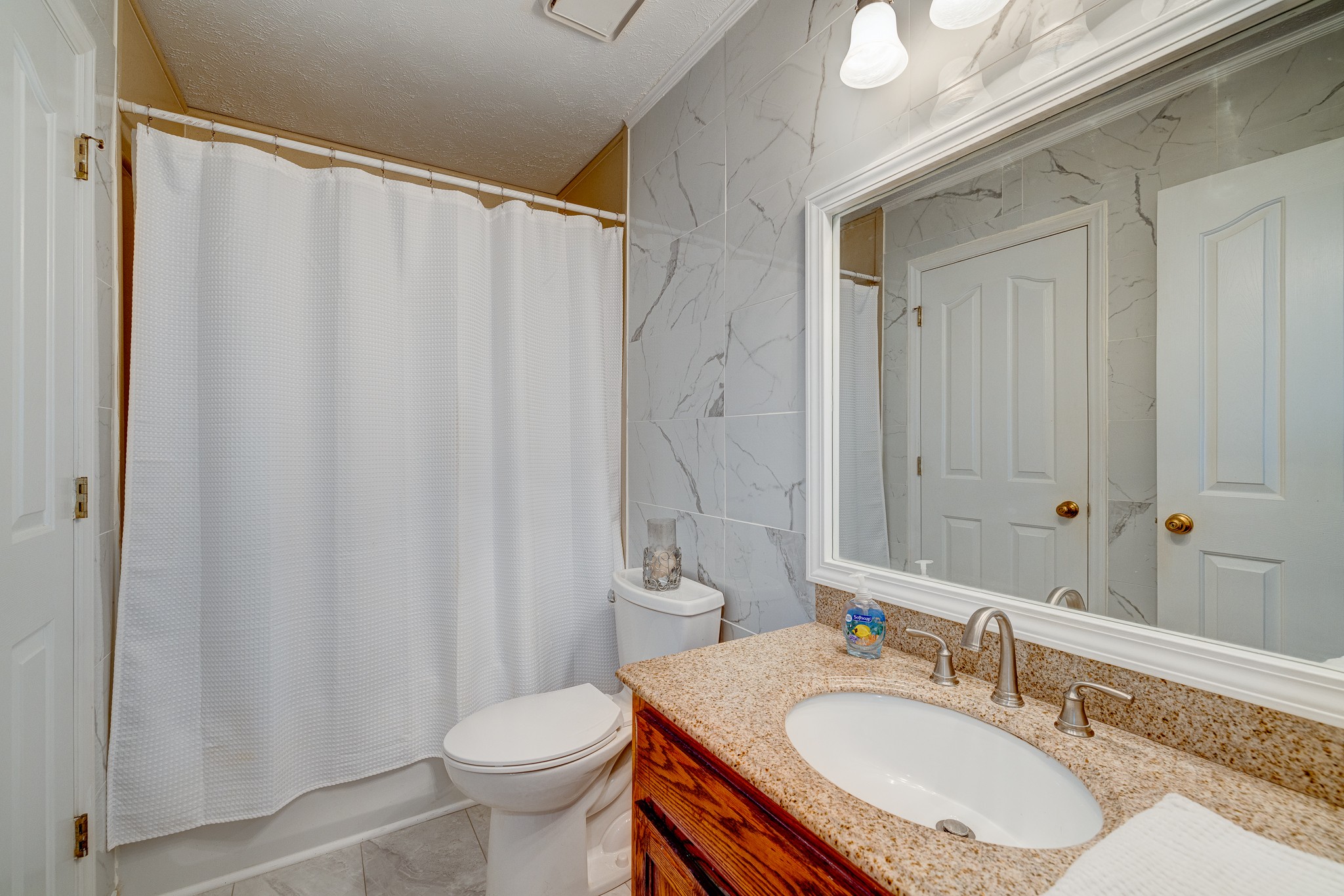 2543 Thompson Road Murfreesboro, TN 37128 - Photo 13 of 46 a bathroom with a granite countertop sink toilet and a mirror