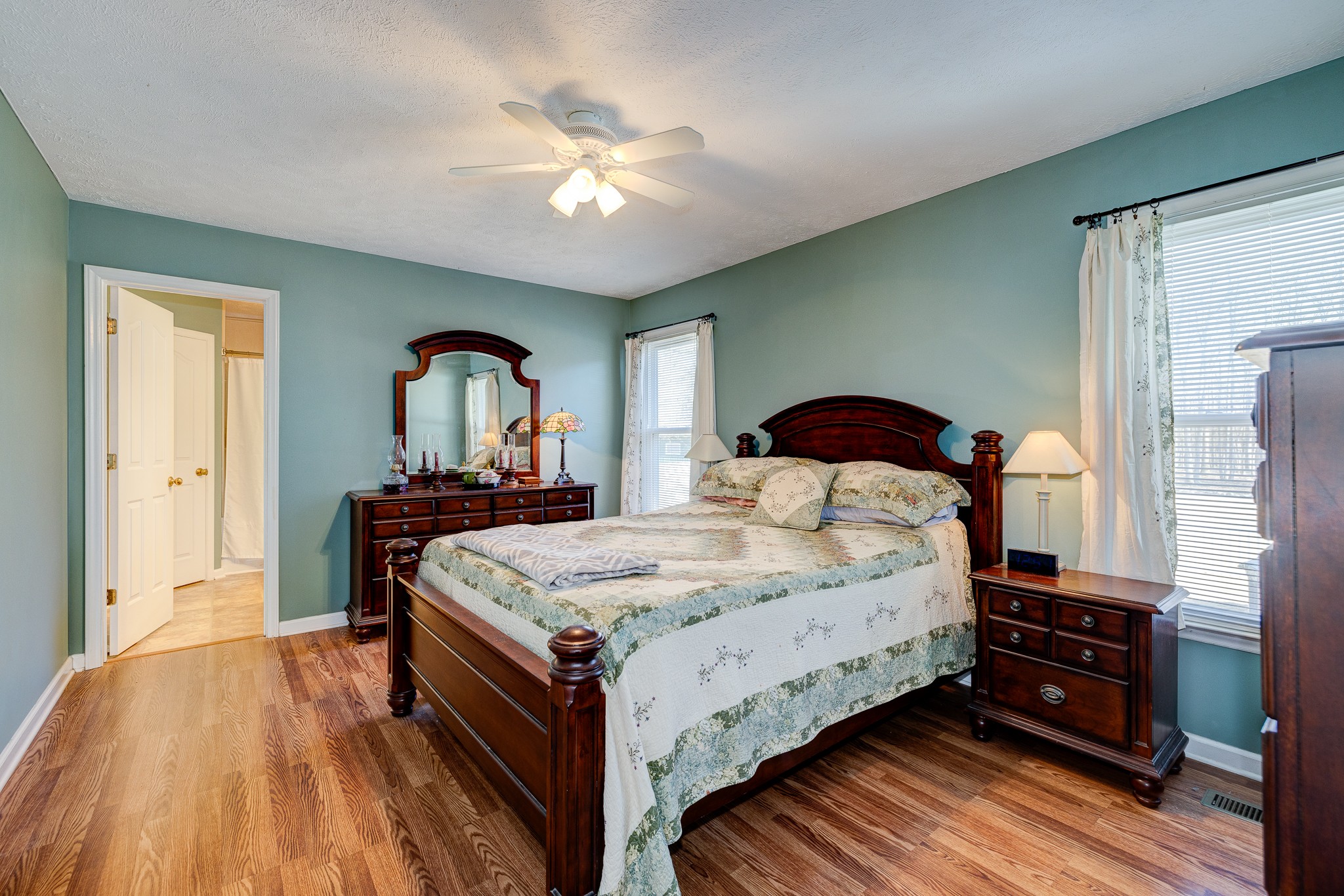2543 Thompson Road Murfreesboro, TN 37128 - Photo 20 of 46 a bedroom with a bed and a chandelier