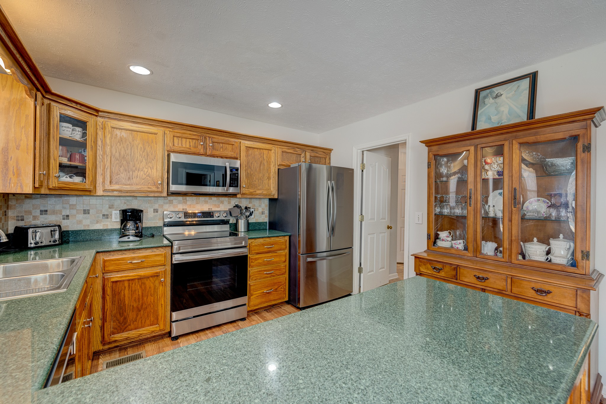 2543 Thompson Road Murfreesboro, TN 37128 - Photo 23 of 46 a kitchen with stainless steel appliances granite countertop a refrigerator a stove top oven and a sink with granite countertops