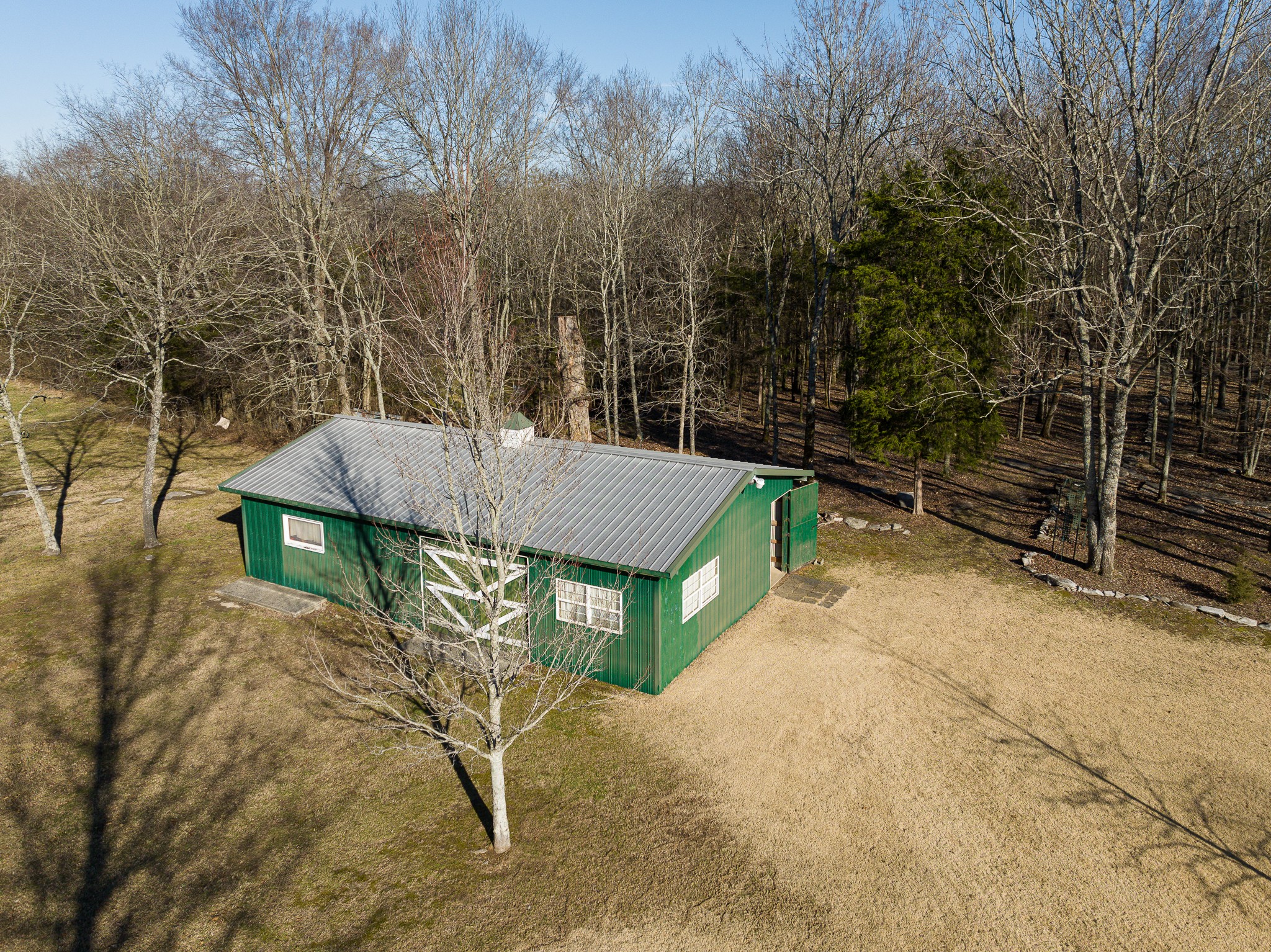2543 Thompson Road Murfreesboro, TN 37128 - Photo 41 of 46 a view of backyard with a table and chairs and a barbeque