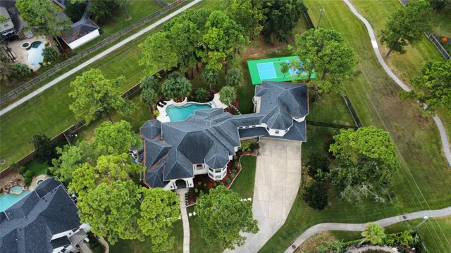 an aerial view of a house with outdoor space and street view